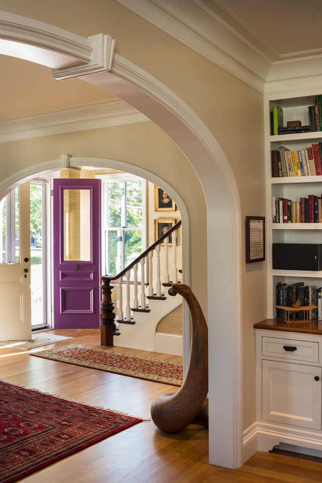 Example of a classic entryway design in Boston with beige walls