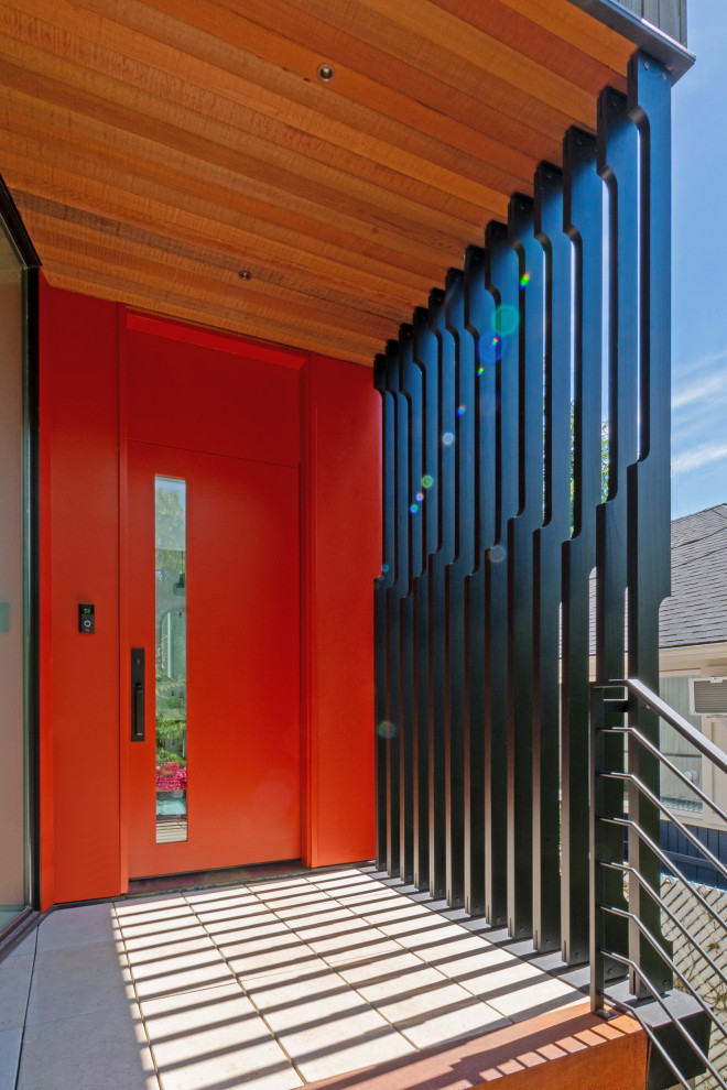 Idée de décoration pour une porte d'entrée design avec une porte simple et une porte rouge.