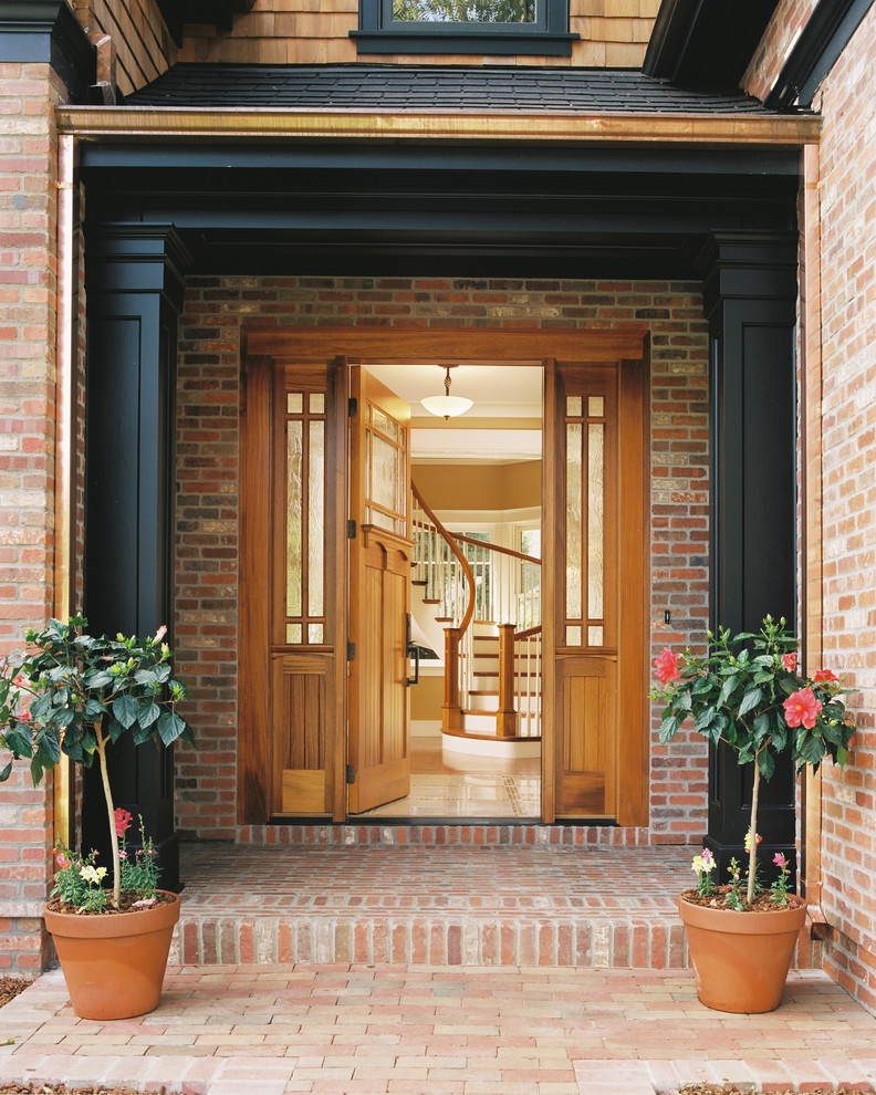Inspiration for a timeless entryway remodel in San Francisco with a light wood front door