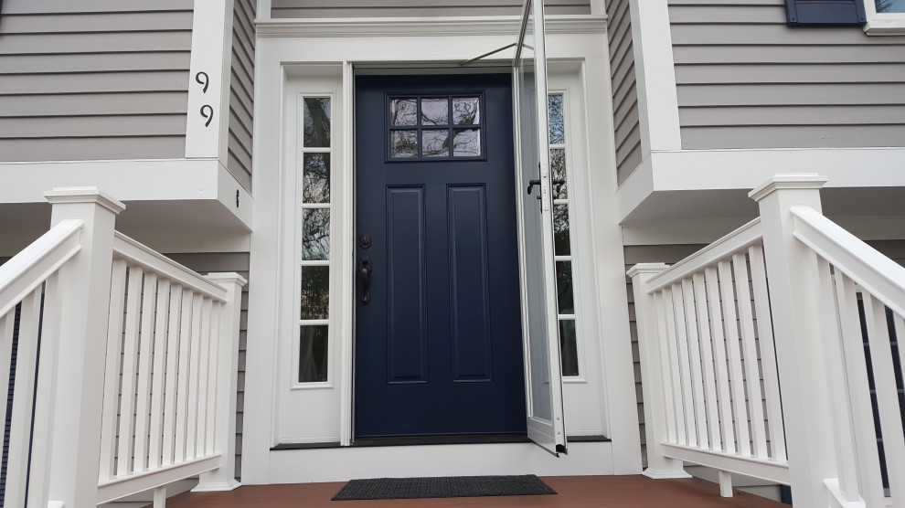 Example of an entryway design in Boston with a blue front door