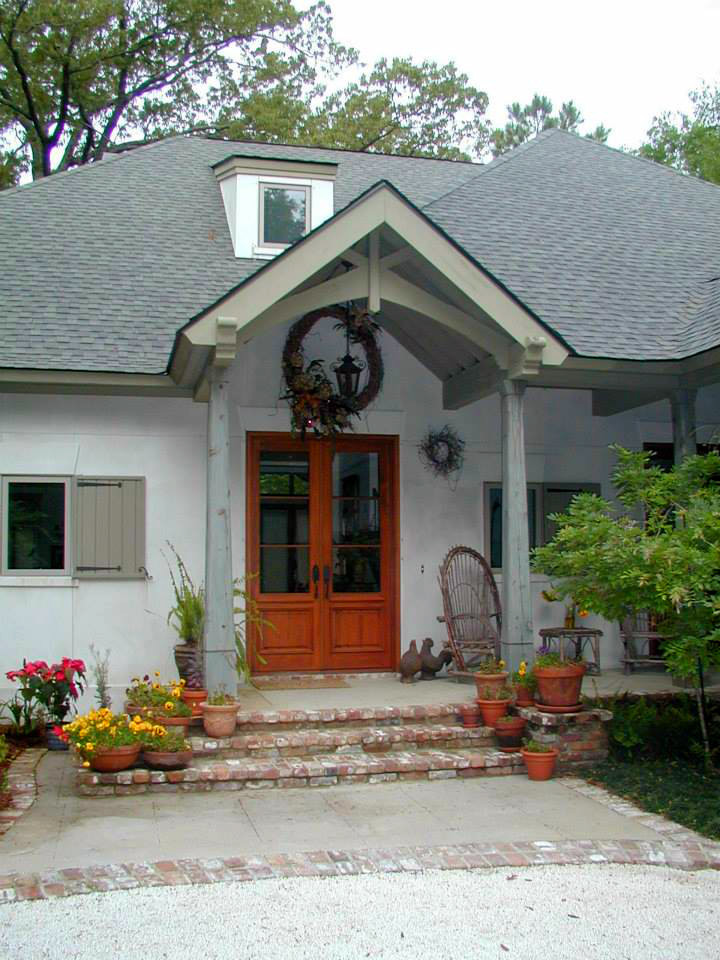 Example of a mid-sized classic entryway design in Miami with a glass front door