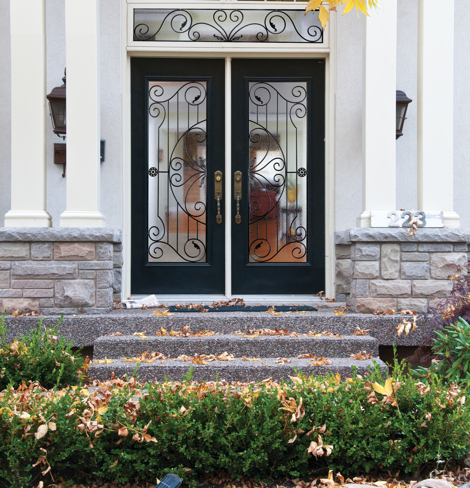 Design ideas for a medium sized traditional front door in Vancouver with a double front door and a glass front door.