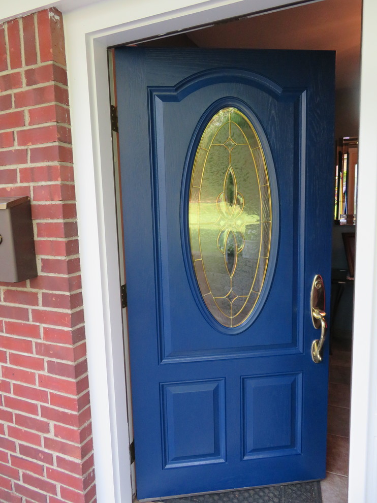 Photo of a medium sized bohemian front door in New York with white walls, a single front door and a blue front door.