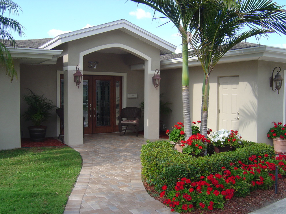 Elegant entryway photo in Tampa with a glass front door