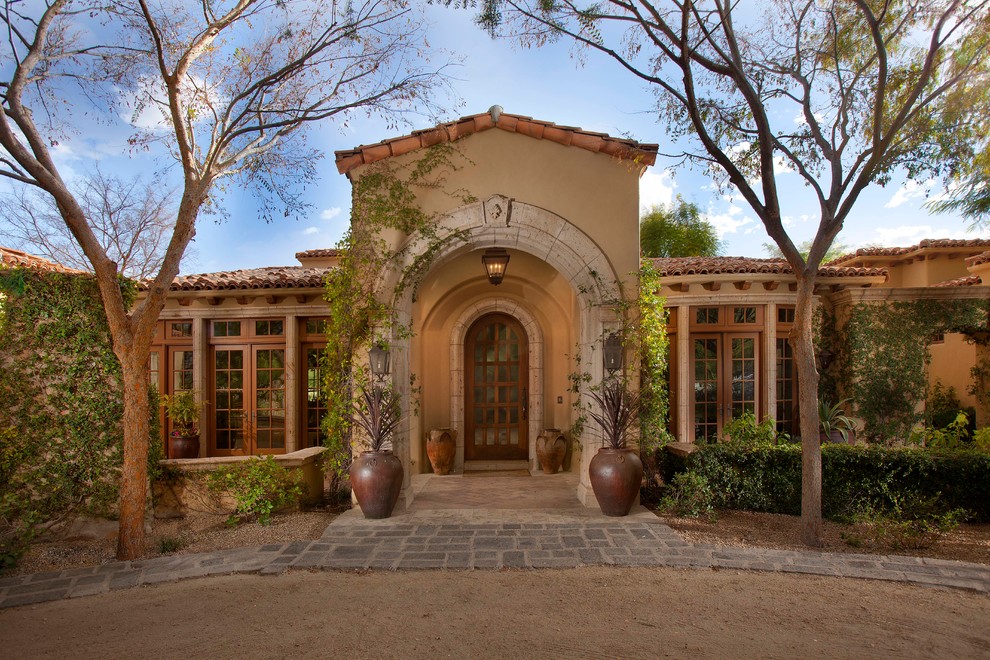 Inspiration for a mediterranean entryway remodel in Phoenix