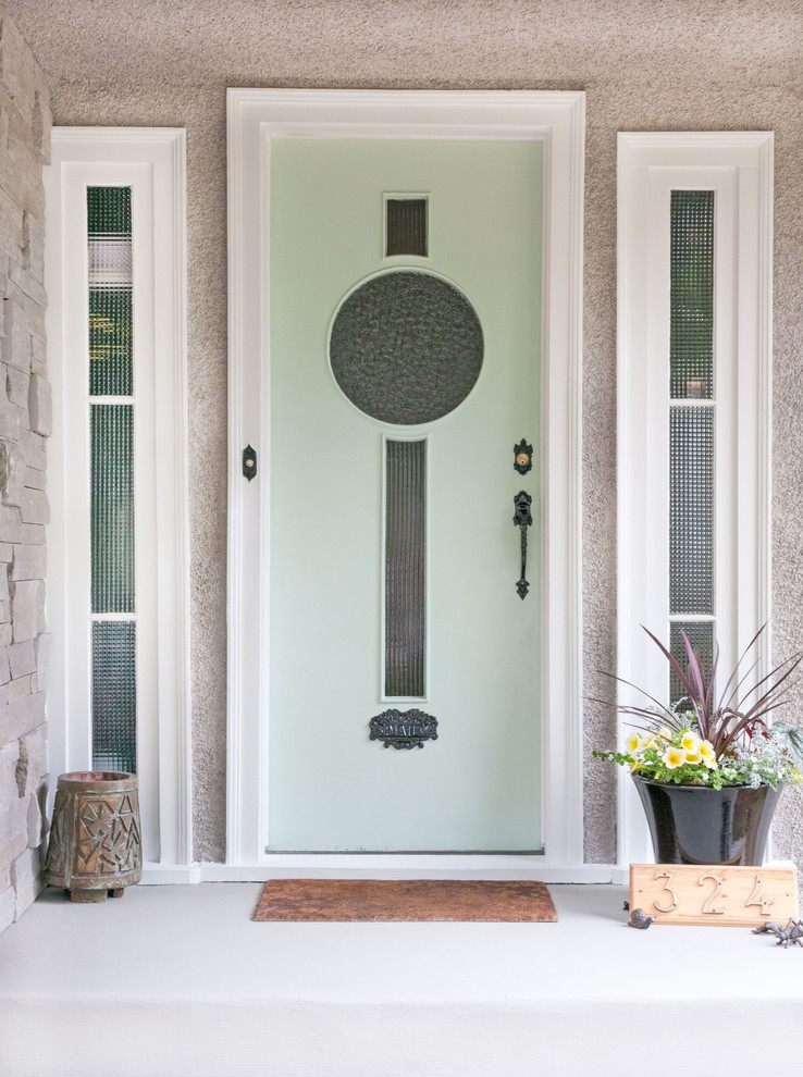 Photo of a front door in Vancouver with beige walls, a single front door and a green front door.