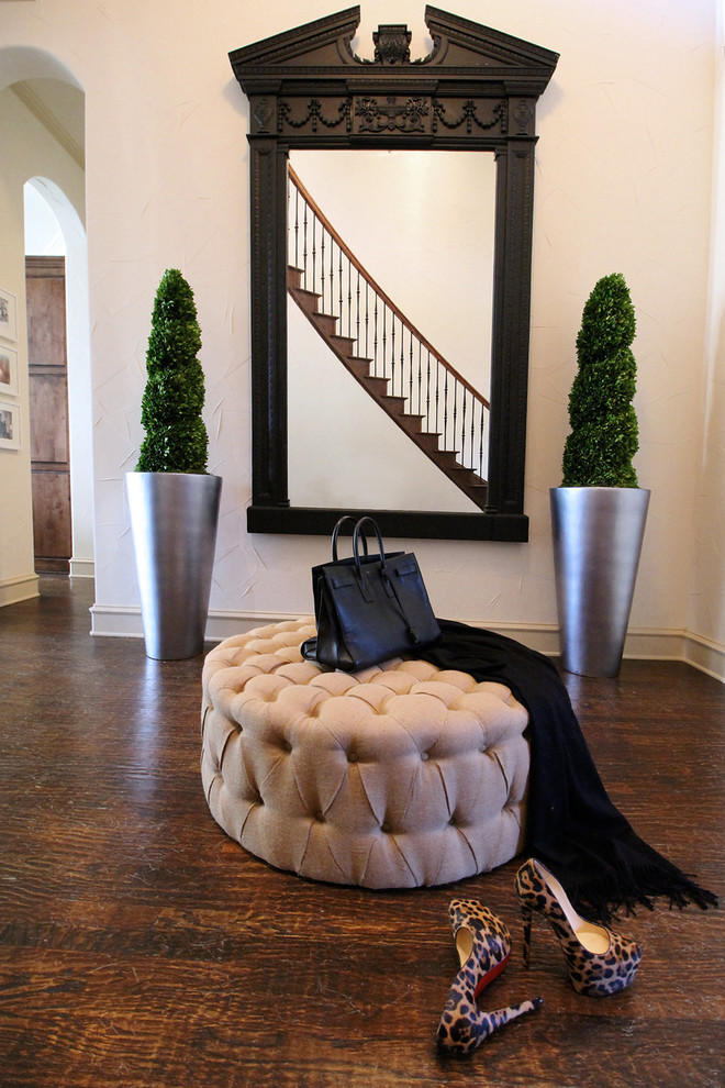 This is an example of a medium sized traditional foyer in Dallas with medium hardwood flooring.