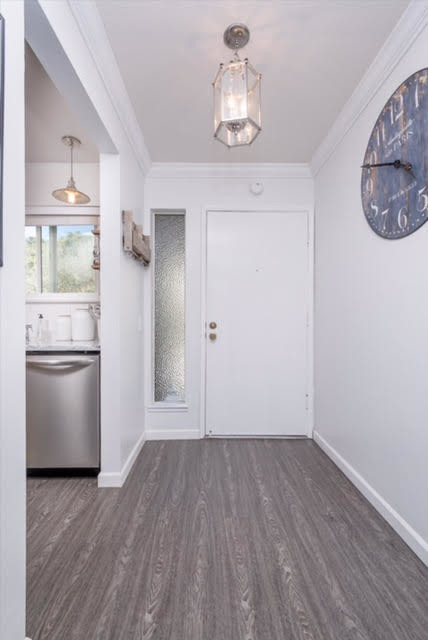 Example of a small farmhouse laminate floor and gray floor entryway design in San Francisco with gray walls and a red front door