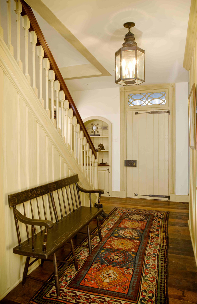 Mid-sized elegant dark wood floor entryway photo in Philadelphia with white walls and a light wood front door