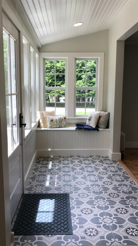 Design ideas for a small farmhouse entrance in New York with porcelain flooring.