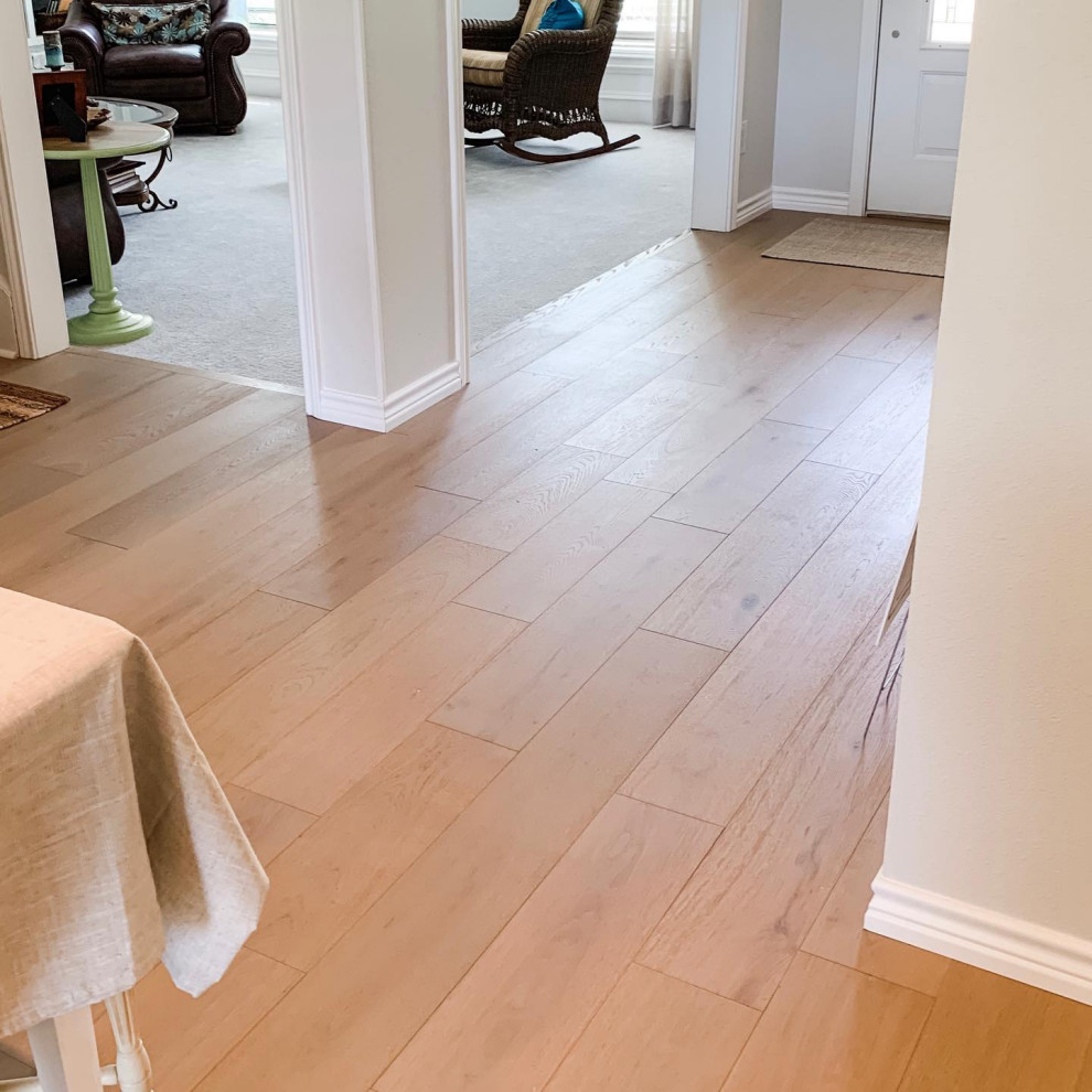 Example of a farmhouse laminate floor and beige floor entryway design in Austin