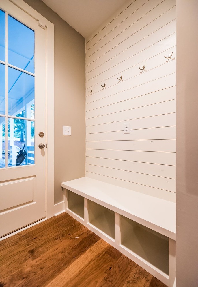 Photo of a medium sized rural front door in Atlanta with grey walls, medium hardwood flooring, a single front door, a white front door and brown floors.