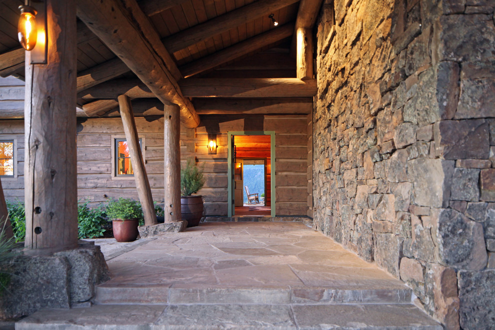 This is an example of a rustic entrance in Minneapolis with a single front door.