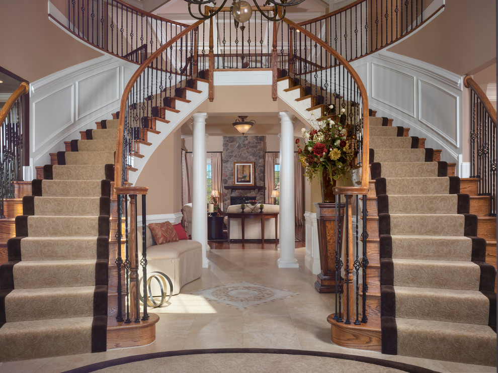 Inspiration for a huge timeless marble floor foyer remodel in Philadelphia with brown walls