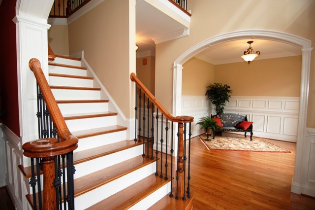 Photo of a large traditional foyer in Dallas with beige walls and medium hardwood flooring.