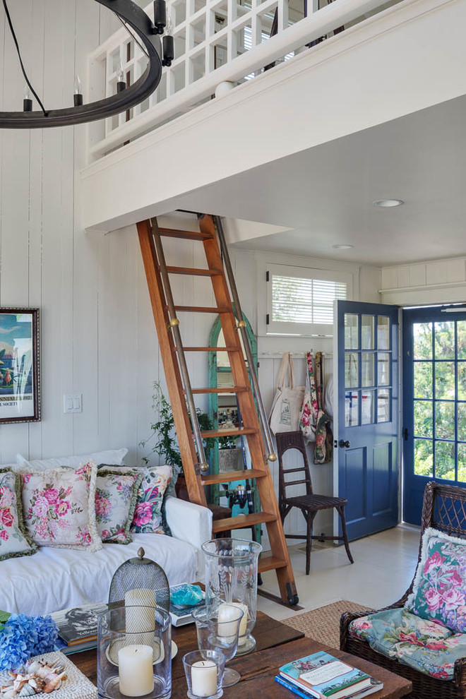 Medium sized nautical front door in Boston with white walls, laminate floors, a single front door and a blue front door.