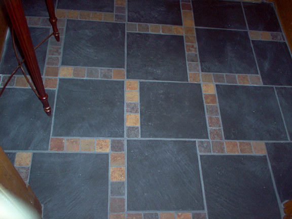 This is an example of a traditional entrance in Montreal with porcelain flooring.