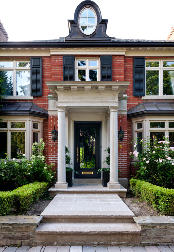 Elegant entryway photo in Toronto with a glass front door