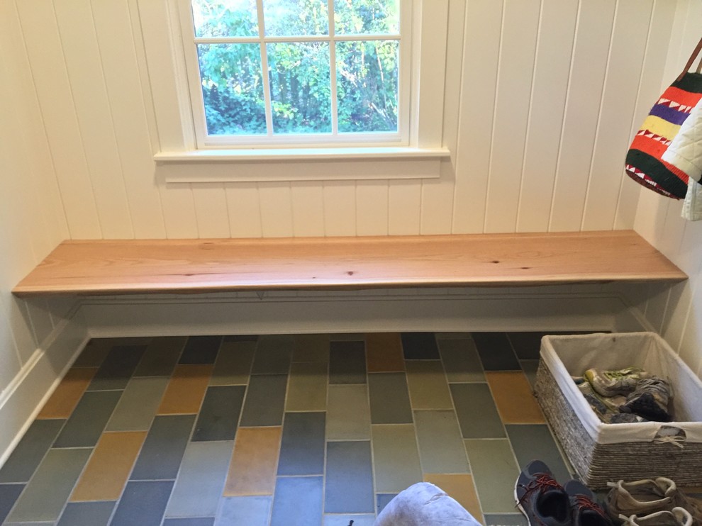 Photo of a large country boot room in Raleigh with white walls, porcelain flooring and multi-coloured floors.