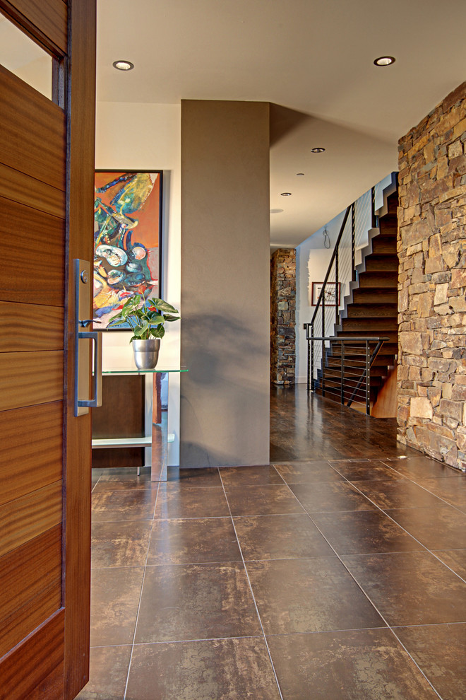 Trendy brown floor entryway photo in Seattle with a medium wood front door