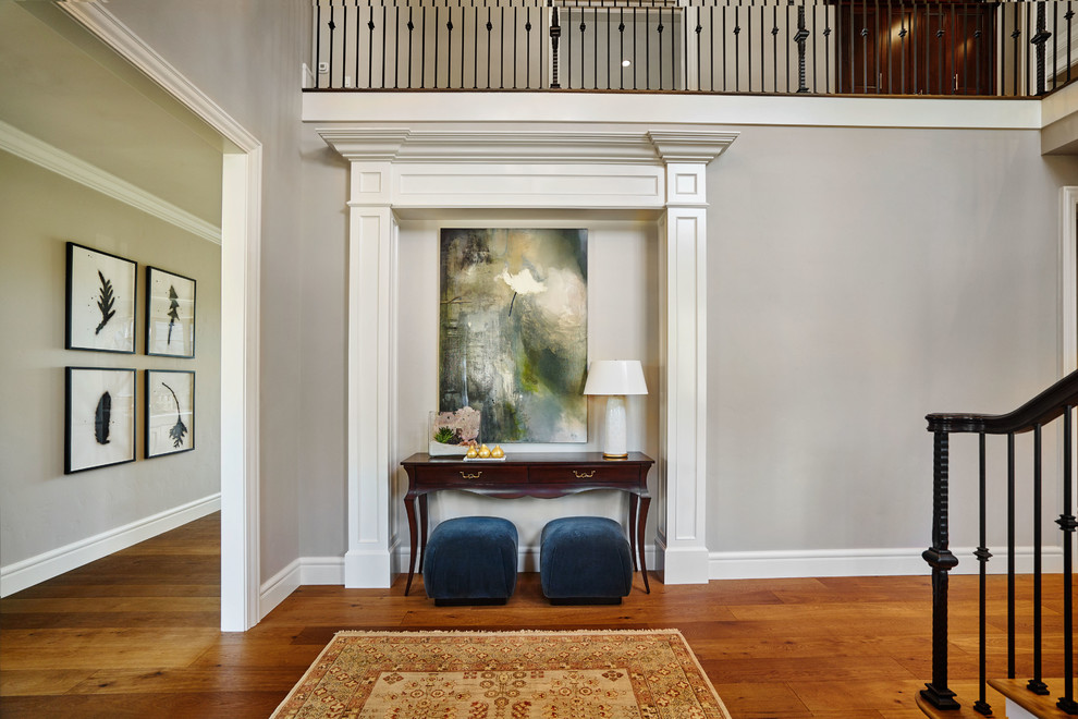 Large classic foyer in Portland with grey walls, medium hardwood flooring, a single front door and feature lighting.