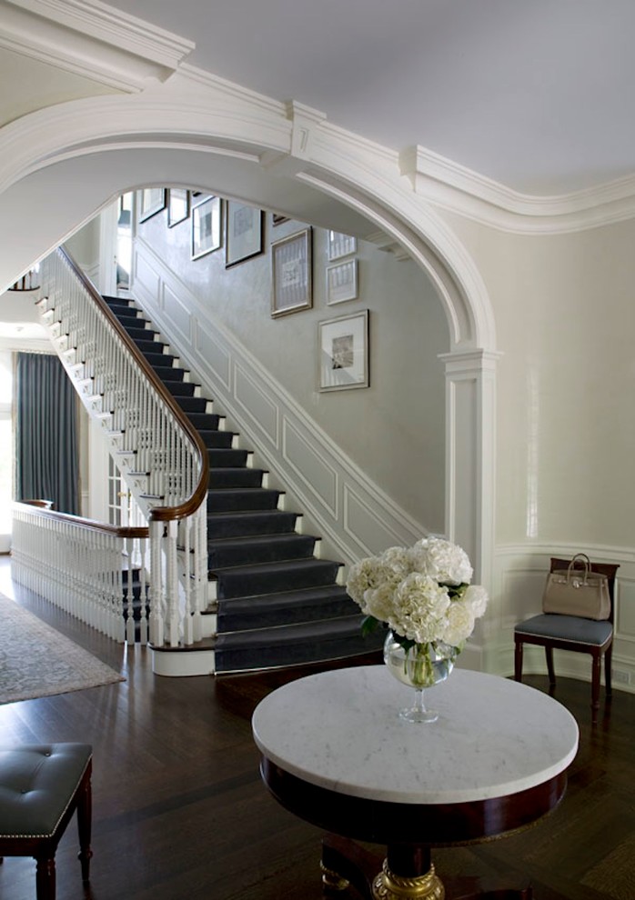 Photo of a traditional foyer in Dallas with beige walls, dark hardwood flooring and brown floors.