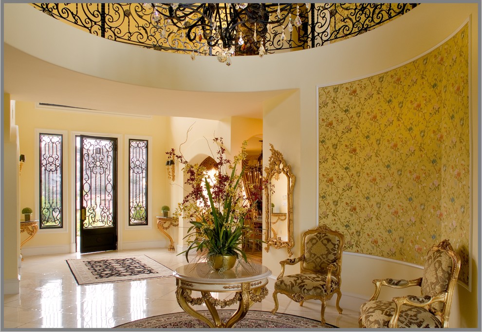 Inspiration for a timeless entryway remodel in Los Angeles with yellow walls