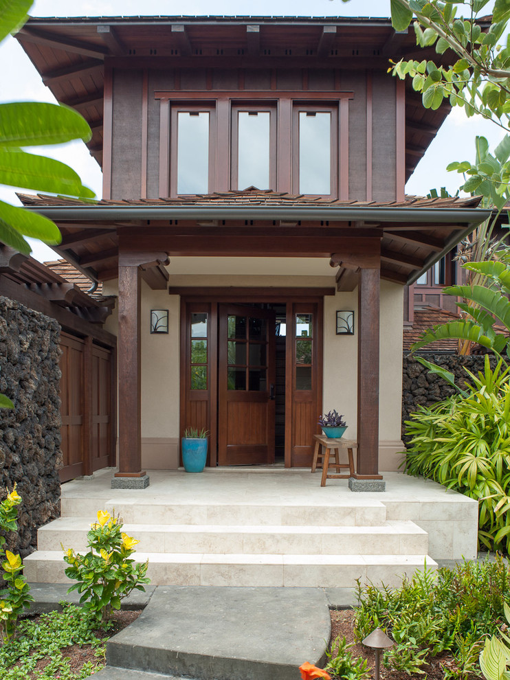 Mid-sized island style single front door photo in Hawaii with beige walls and a dark wood front door