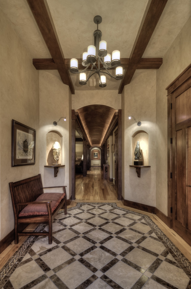 Inspiration for a timeless entry hall remodel in Denver with beige walls