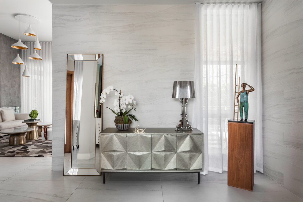 Example of a small trendy marble floor foyer design in Miami