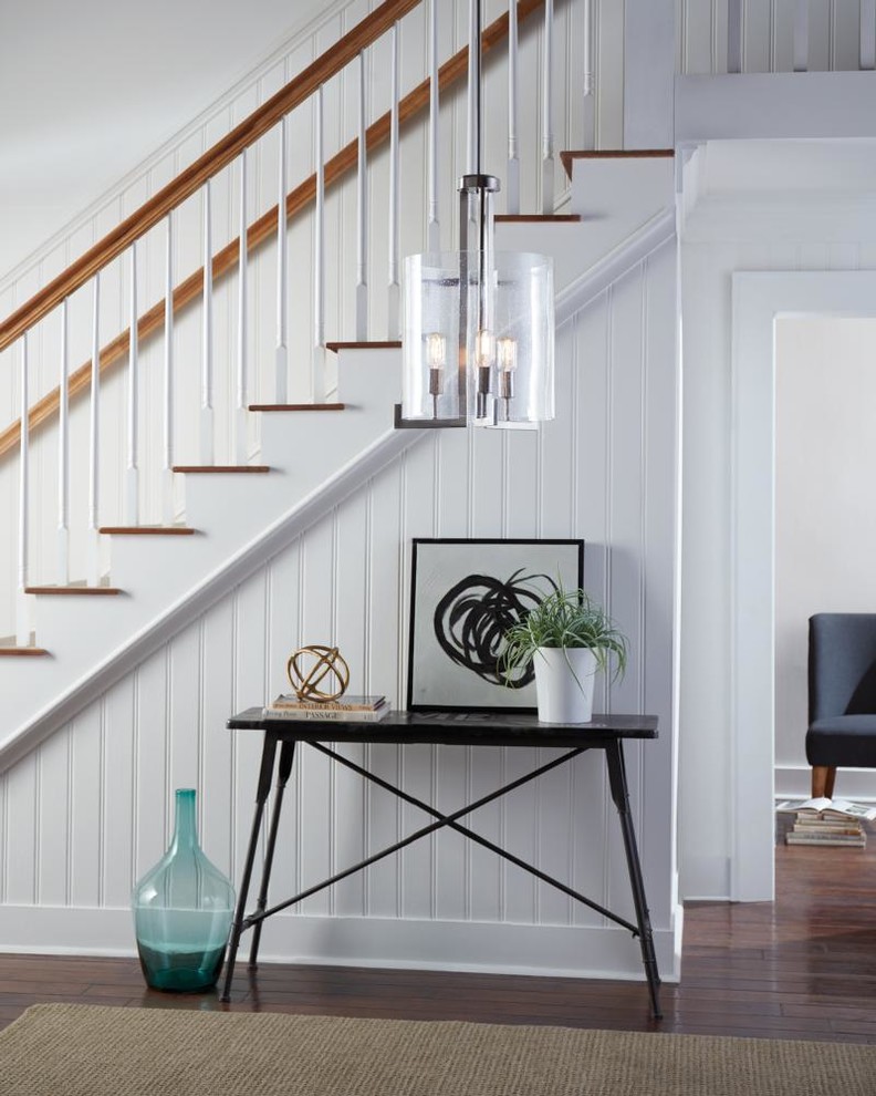 Design ideas for a small farmhouse foyer in Other with white walls, dark hardwood flooring and brown floors.