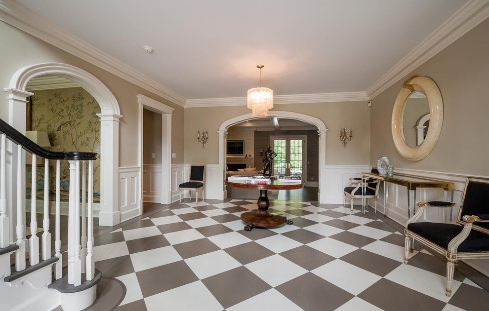 Photo of a medium sized traditional foyer in New York with beige walls, porcelain flooring and multi-coloured floors.