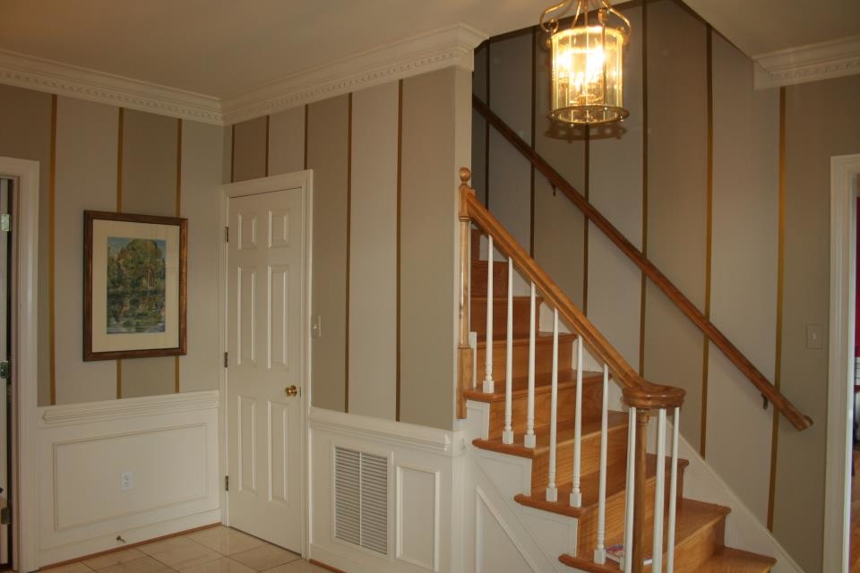 This is an example of a medium sized traditional entrance in Richmond with multi-coloured walls, porcelain flooring and beige floors.