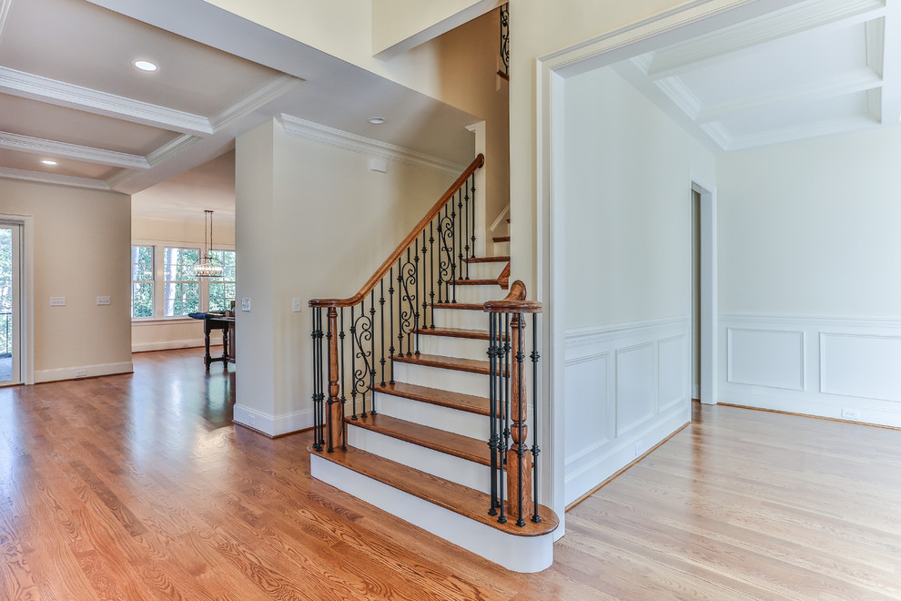 Inspiration for a medium sized classic foyer in Raleigh with beige walls, medium hardwood flooring, a double front door and a dark wood front door.