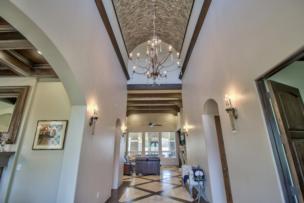 Inspiration for a large timeless marble floor and beige floor entry hall remodel in Phoenix with gray walls