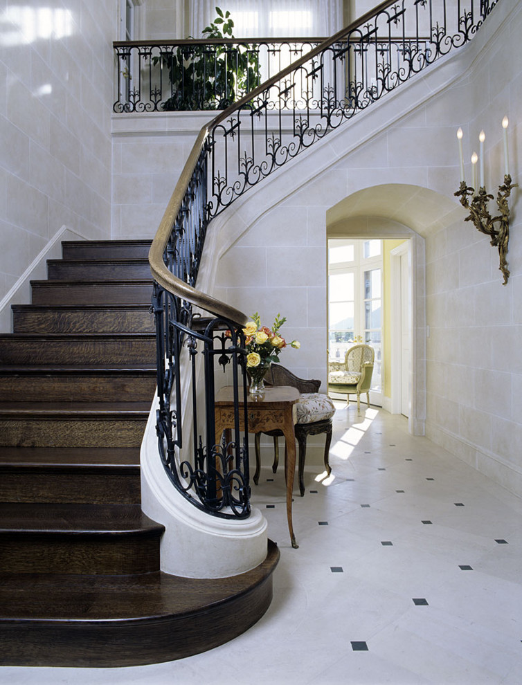 Example of a classic foyer design in Santa Barbara with beige walls