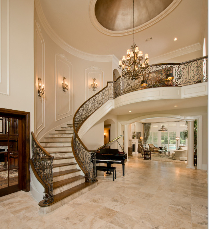 Inspiration for a mid-sized timeless travertine floor and beige floor entryway remodel in Houston with beige walls and a dark wood front door