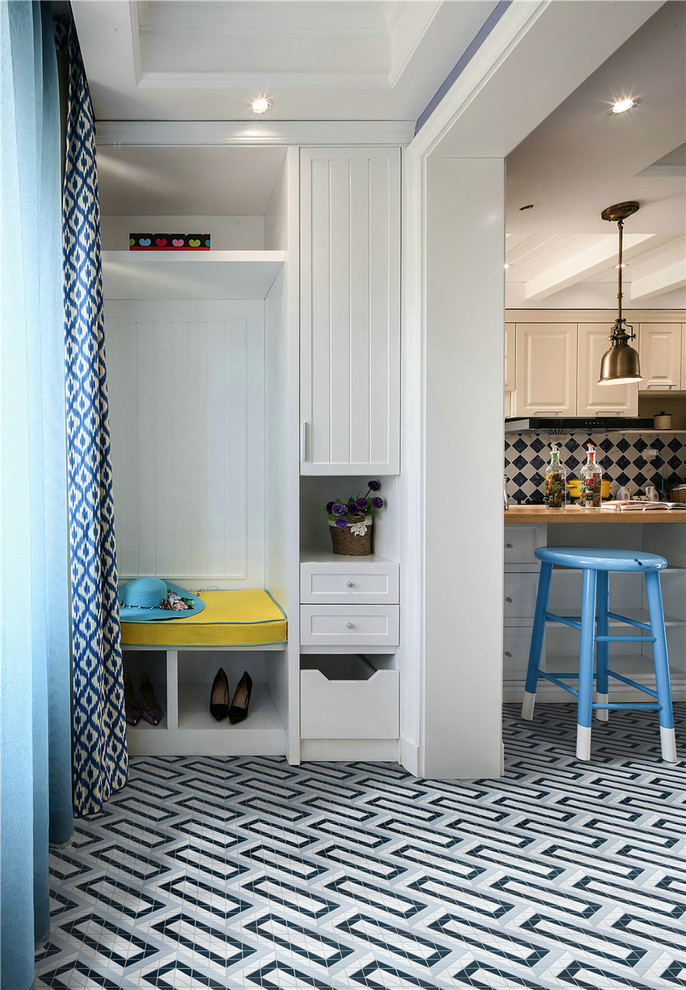 Inspiration for a contemporary porcelain tile and blue floor entryway remodel in Orange County