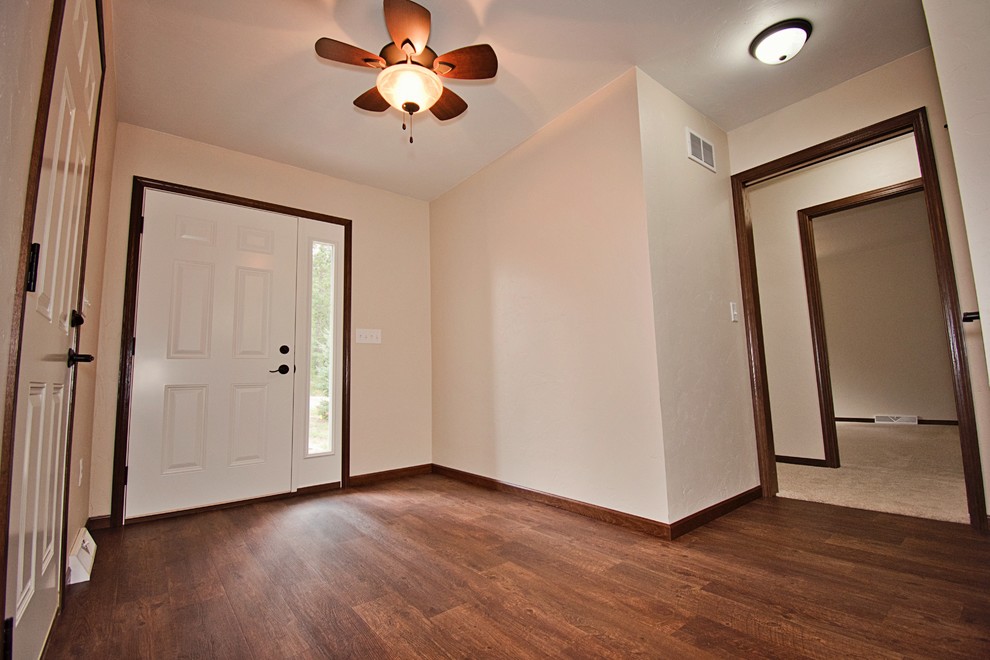 Photo of a medium sized traditional entrance in Other with medium hardwood flooring and brown floors.