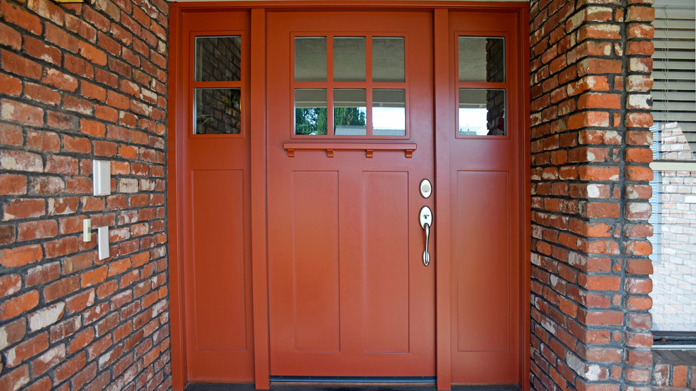 Immagine di una porta d'ingresso chic con una porta singola e una porta rossa