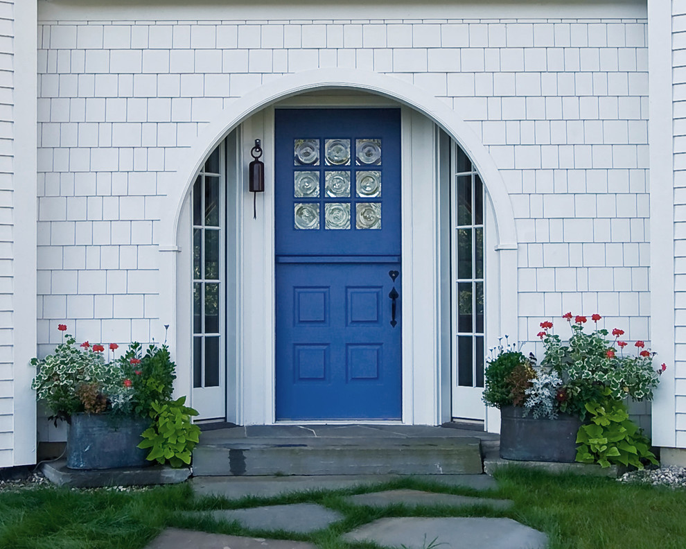 Inspiration for a timeless entryway remodel in Chicago with a blue front door