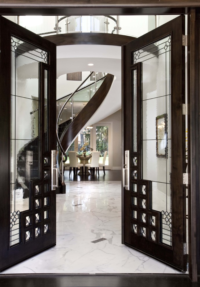 Design ideas for a contemporary foyer in San Francisco with white walls, a double front door, a glass front door and marble flooring.