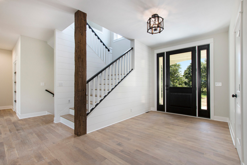 Inspiration for a farmhouse entryway remodel in Grand Rapids