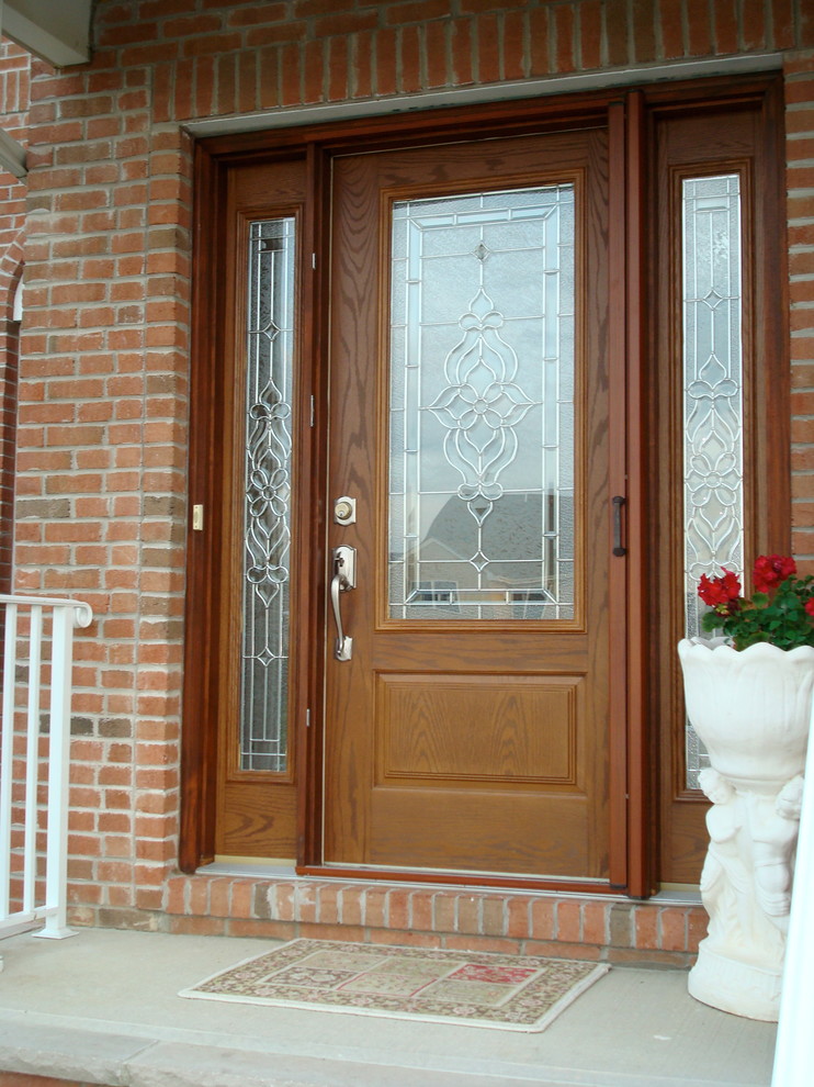 Design ideas for a medium sized traditional front door in New York with a single front door and a medium wood front door.