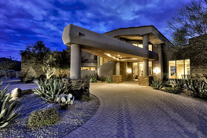This is an example of an expansive classic front door in Phoenix with beige walls, concrete flooring, a double front door and a glass front door.