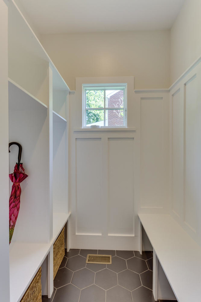 Small elegant porcelain tile mudroom photo in DC Metro with white walls