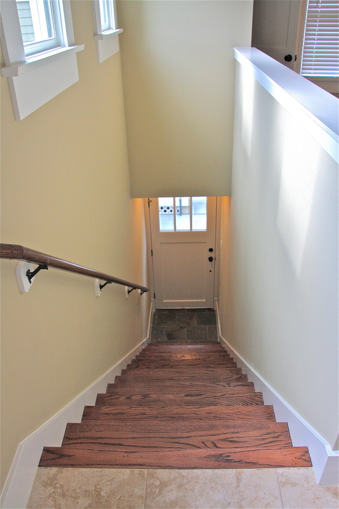 Example of an arts and crafts foyer design in Other