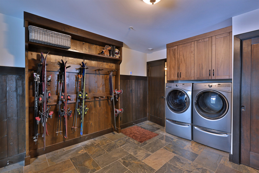 Example of a mountain style slate floor, gray floor and shiplap wall entryway design in Vancouver with white walls and a dark wood front door