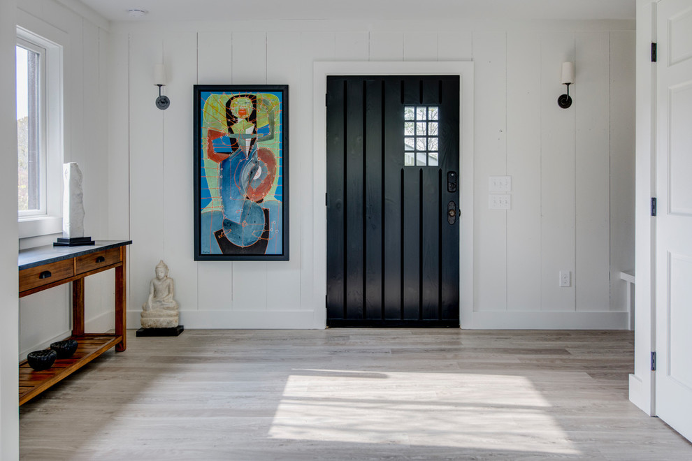 Inspiration for a country single front door remodel in New York with a black front door