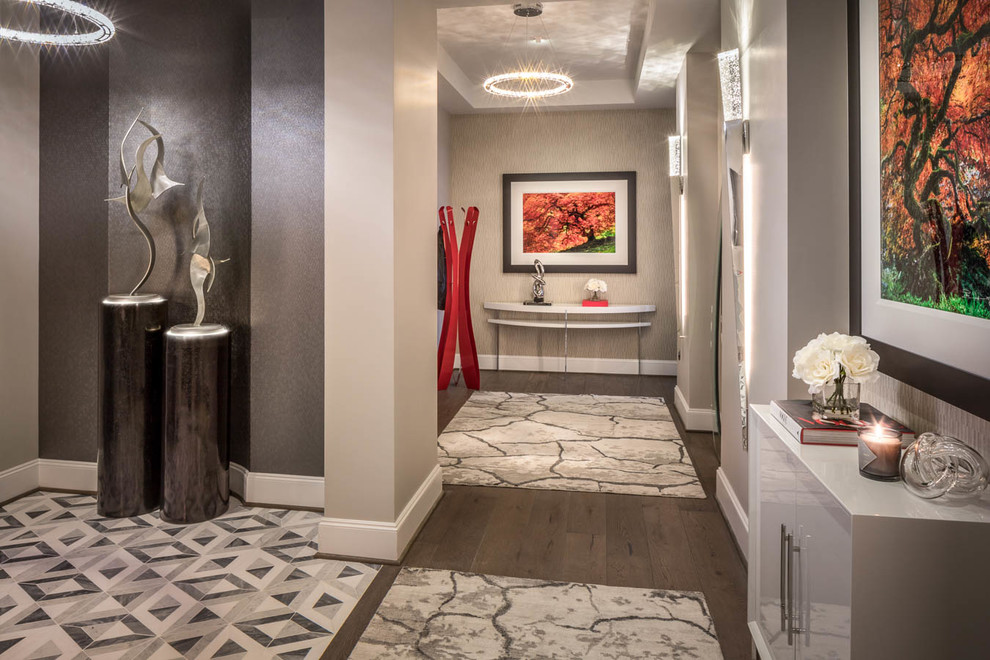 Inspiration for a large modern marble floor and multicolored floor foyer remodel in Houston with gray walls